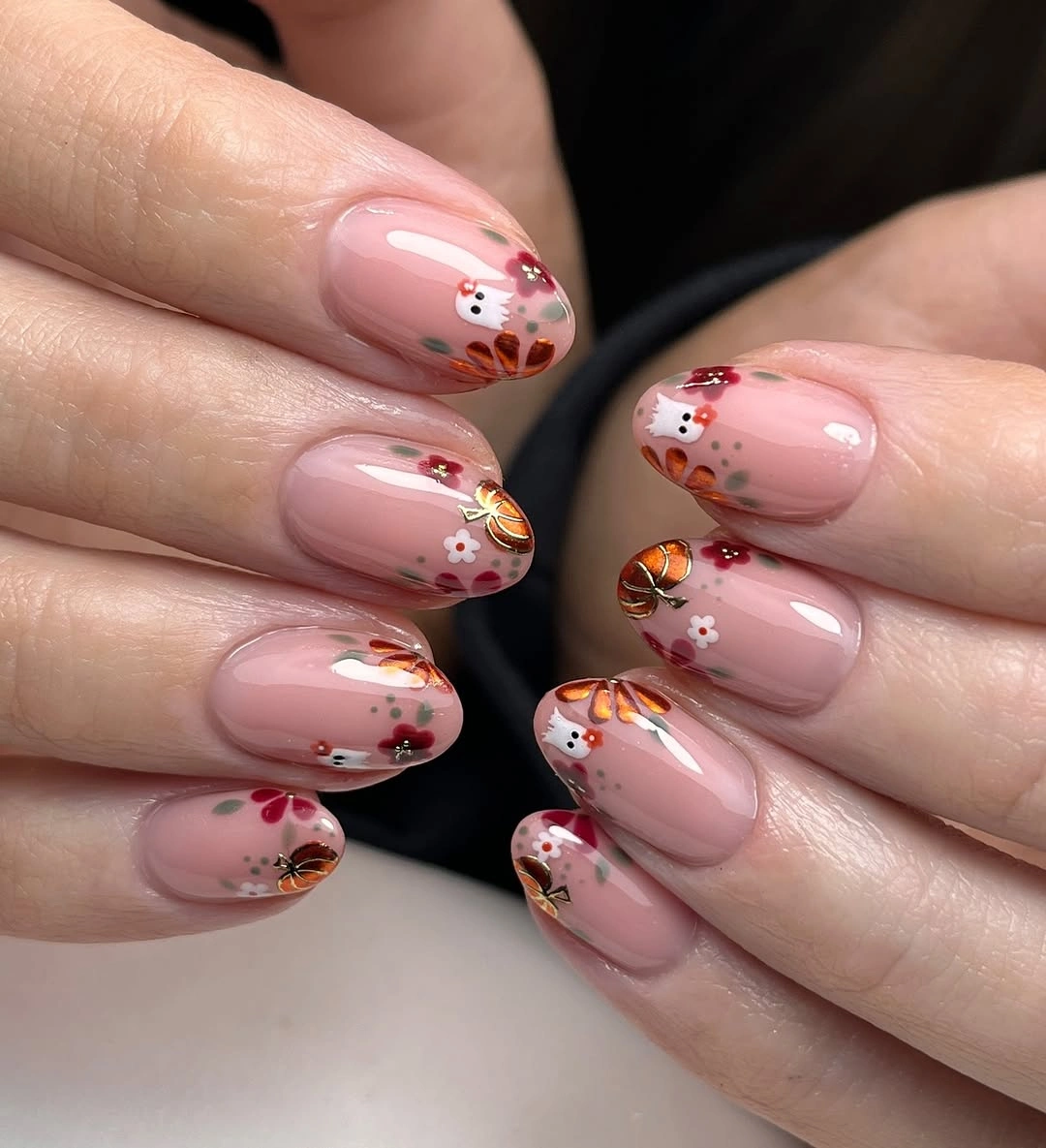 Sheer blush nails with tiny fall flowers