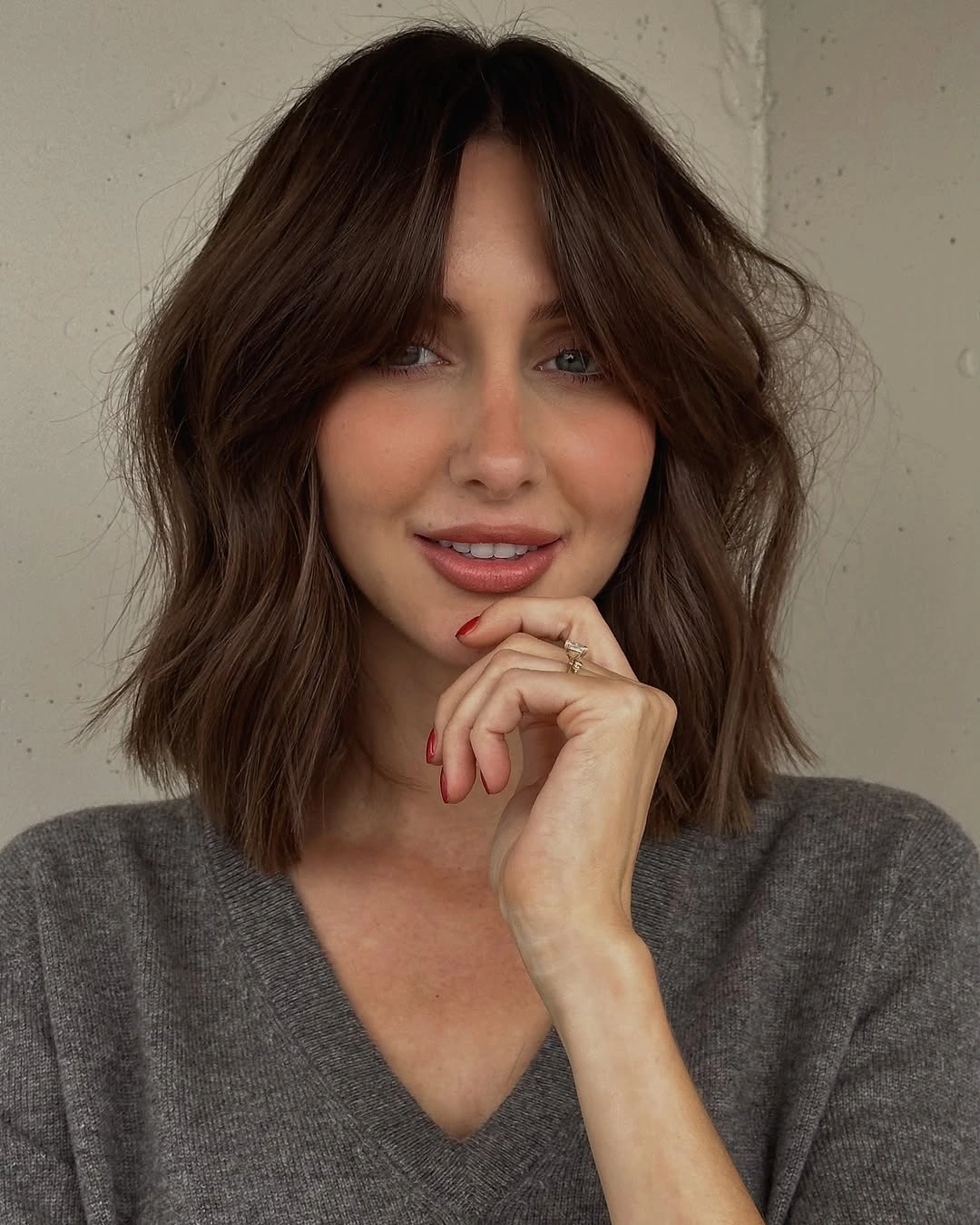 short dark brunette hair with soft curtain bangs