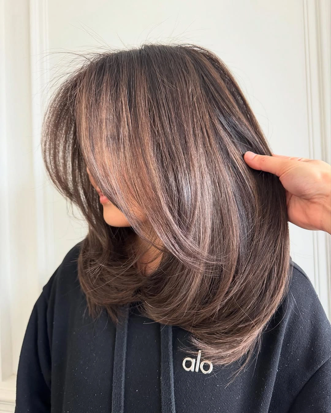 smoky brown shoulder-length hair with soft movement