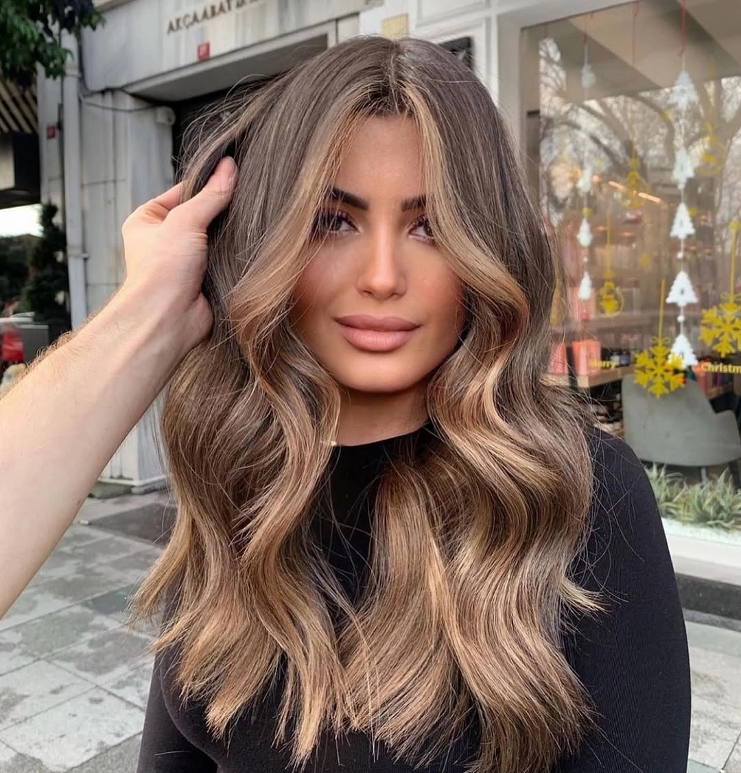 ashy brunette hair with soft face-framing highlights