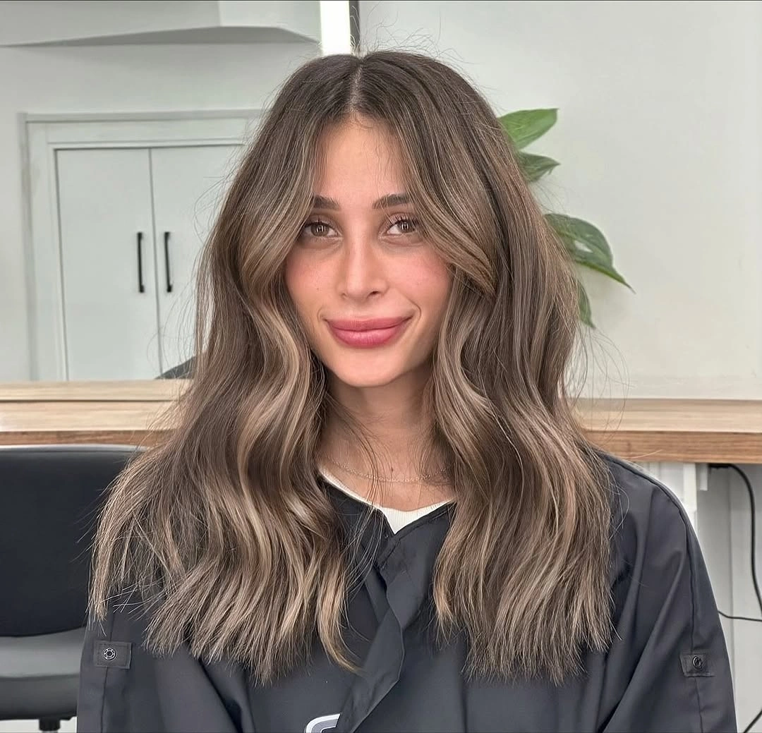 mushroom brown hair with cool face-framing waves