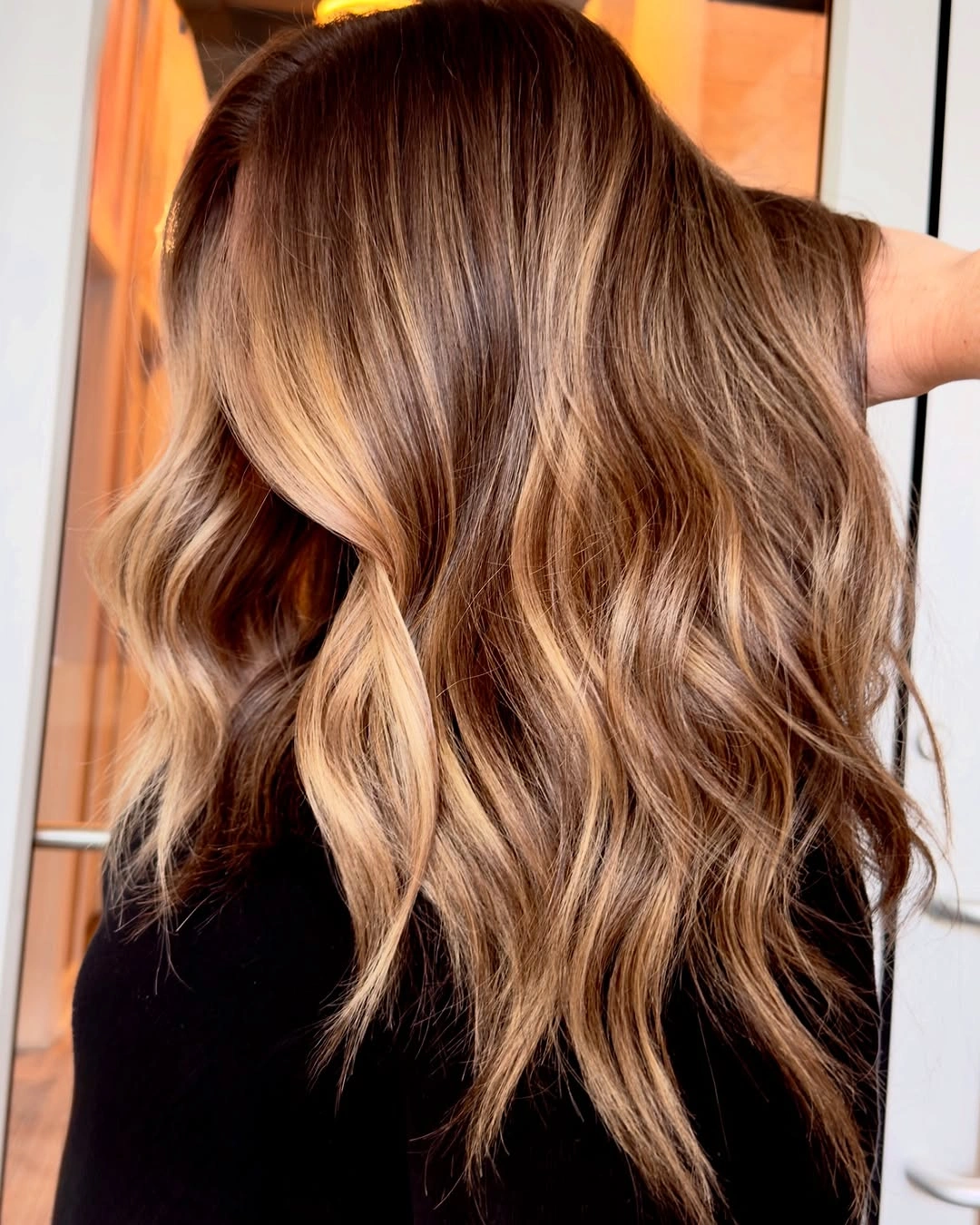 chocolate brown hair with caramel balayage waves