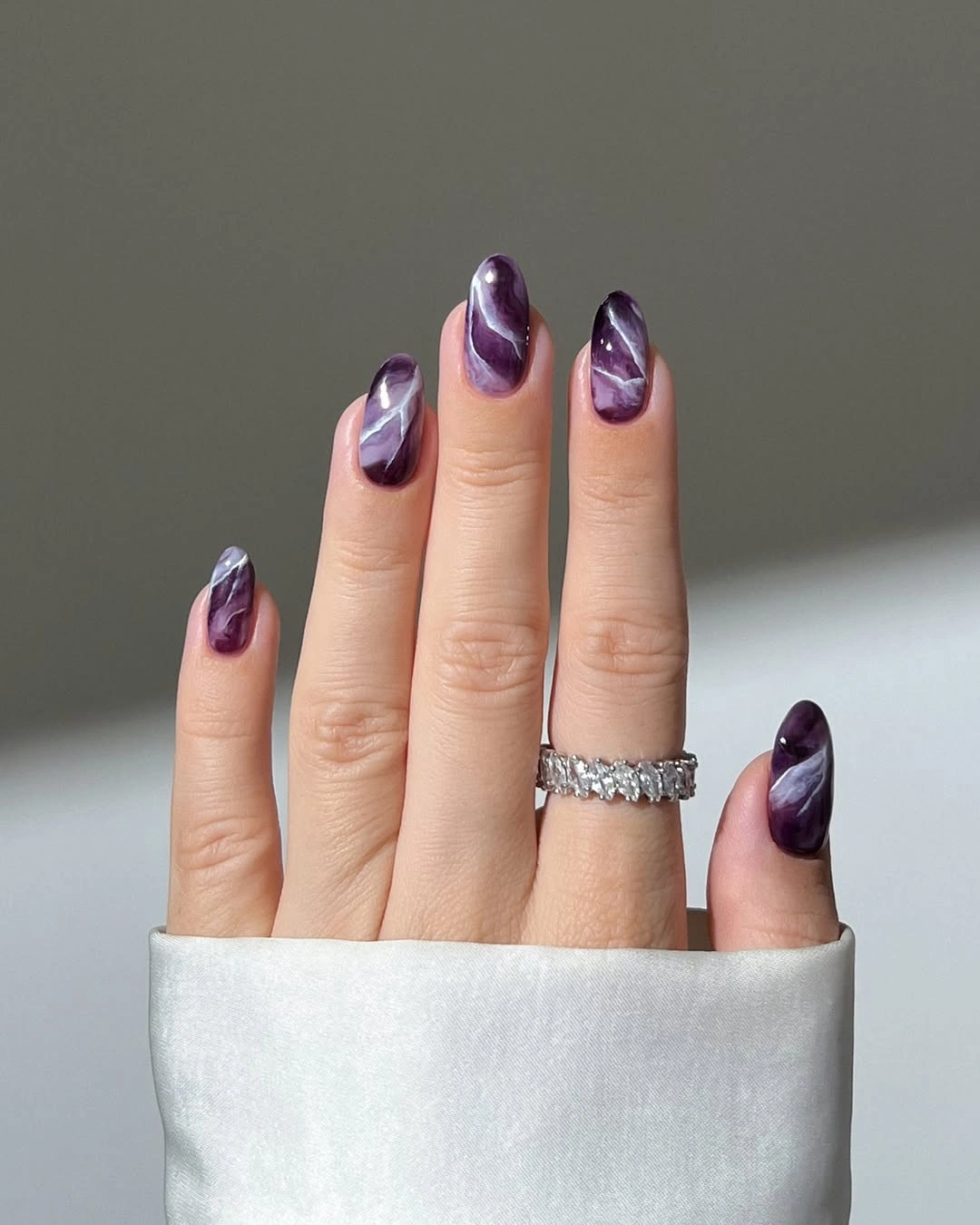 Fall nail idea: long almond purple marbled manicure