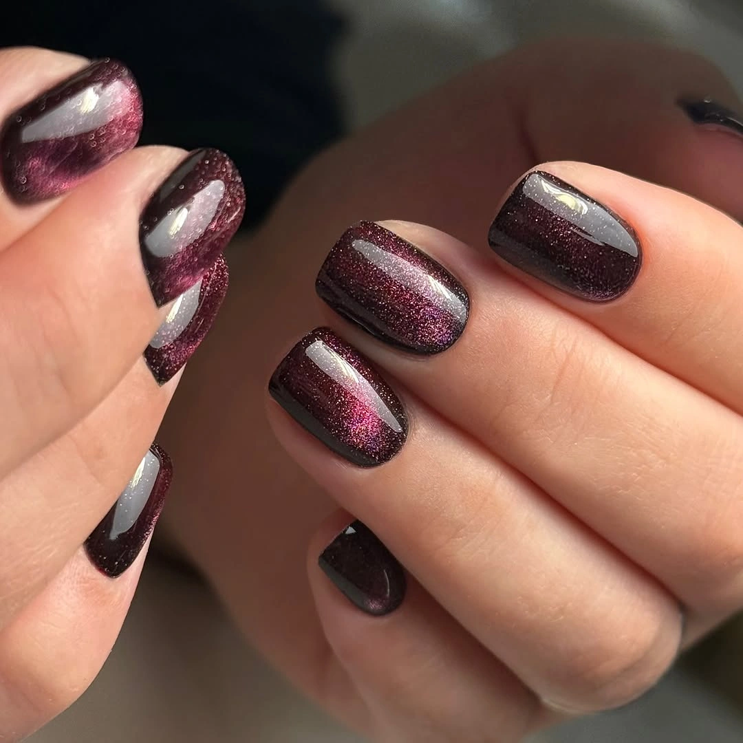 Fall nail idea: short rounded dark mauve manicure with chrome-like panels