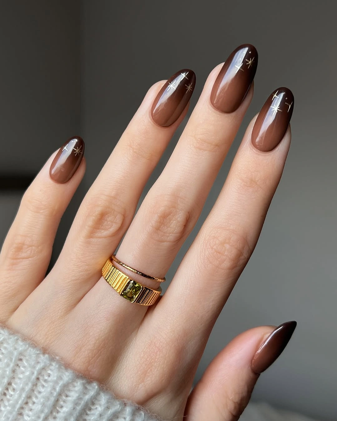 Fall nail idea: medium almond chocolate manicure with fine pale accents