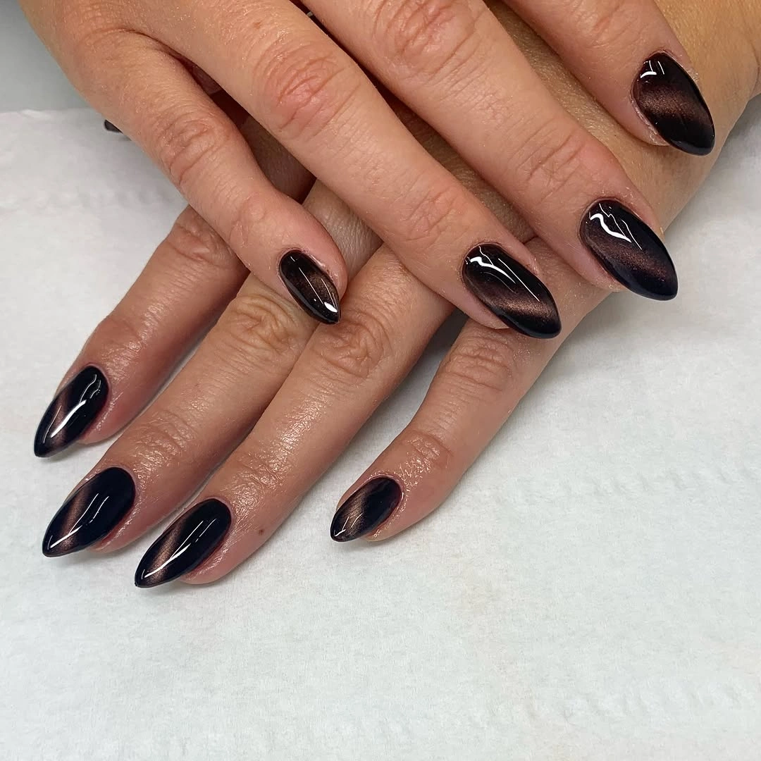 Fall nail idea: medium almond black-plum reflective manicure