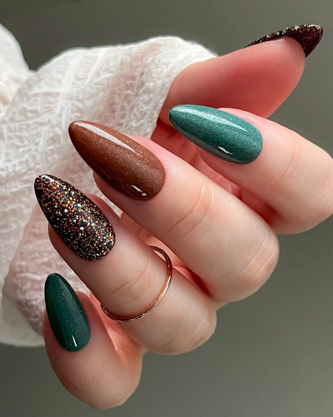 Green brown nails with a dark gold fleck accent