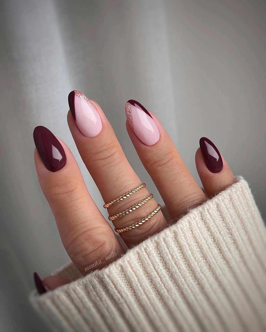 burgundy curves over pale pink
