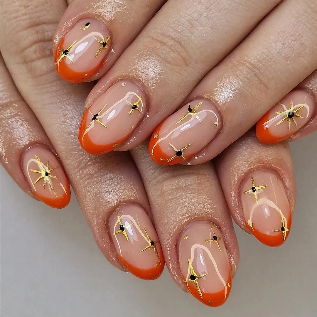 orange French tips with tiny floral line details