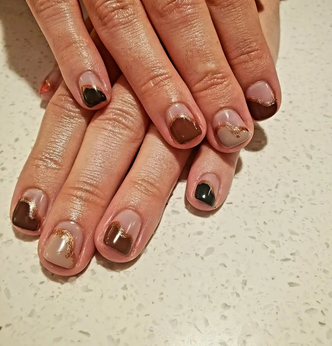 tortoise panels on short brown nails