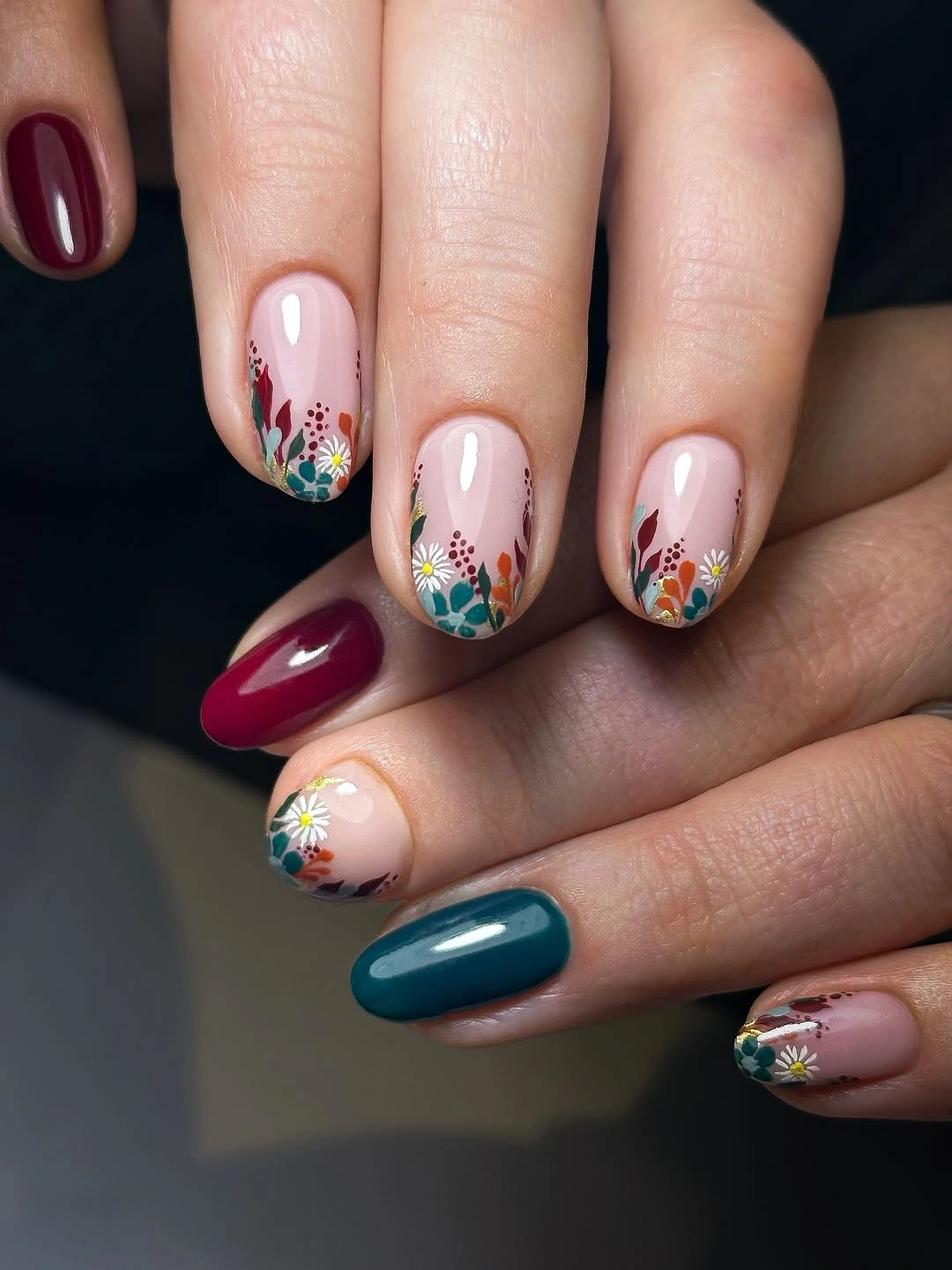 short rounded berry teal nails with floral accents