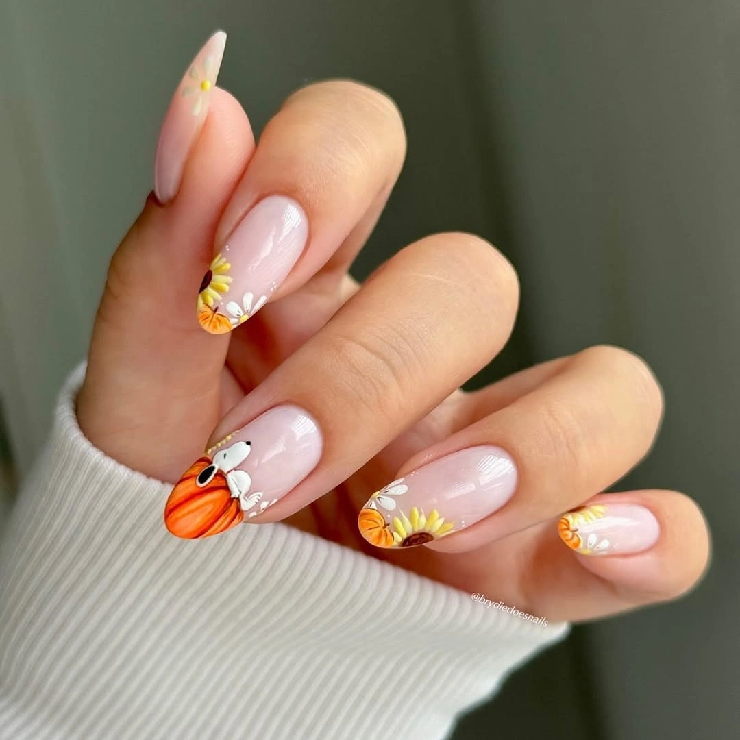 long almond nails with orange and yellow floral tips