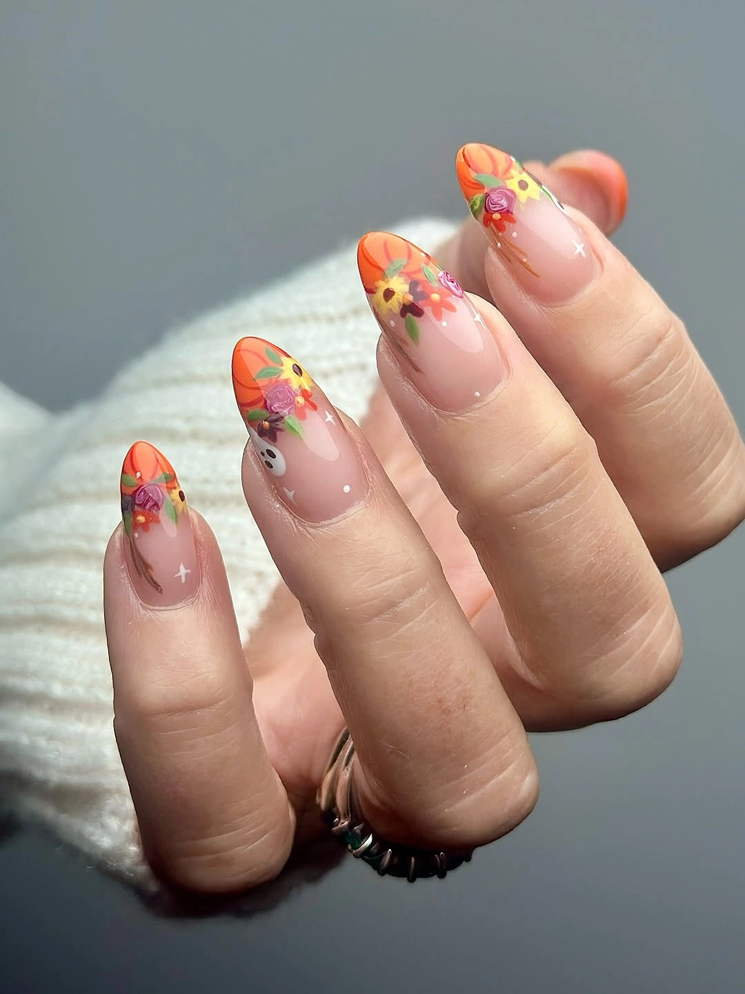Translucent pink nails with colorful autumn flower tips