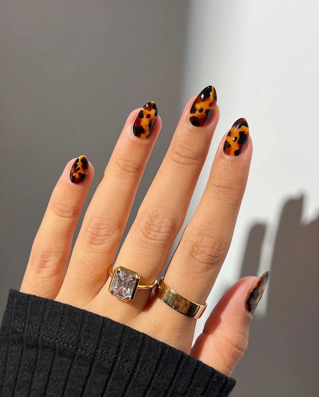 Long almond nails with orange brown spotted accents