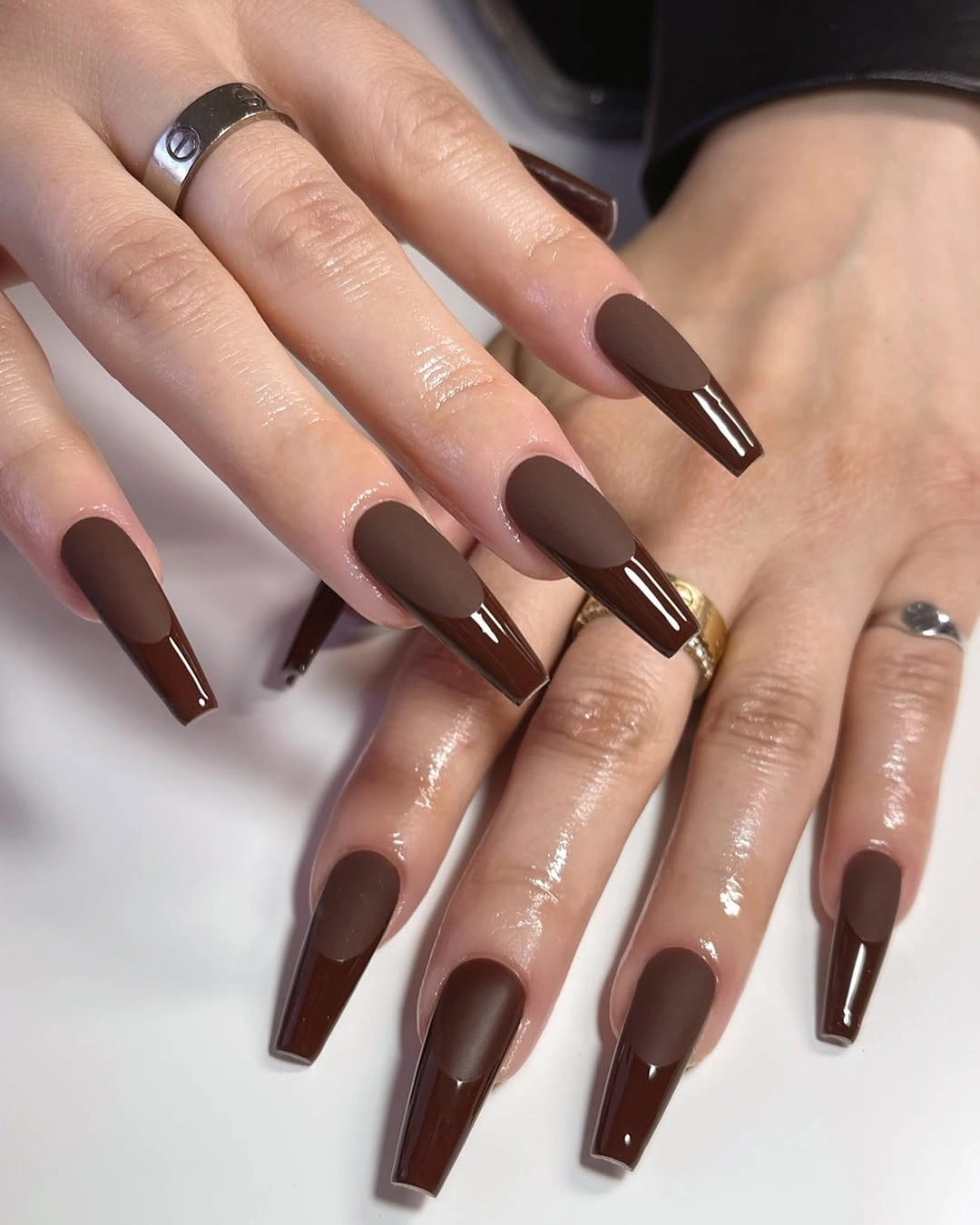 Very long coffin nails with deep cocoa and glossy tips