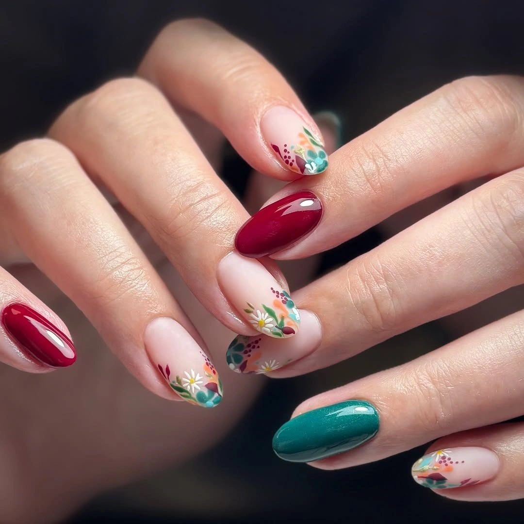 Medium teal burgundy nails with floral tip accents