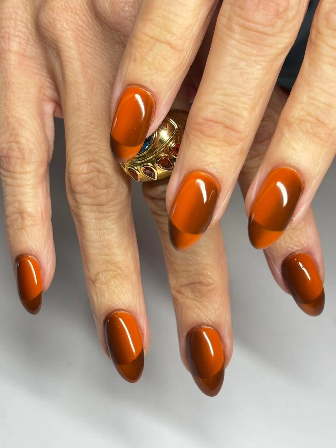 dark brown nails with bright pink graphic lines
