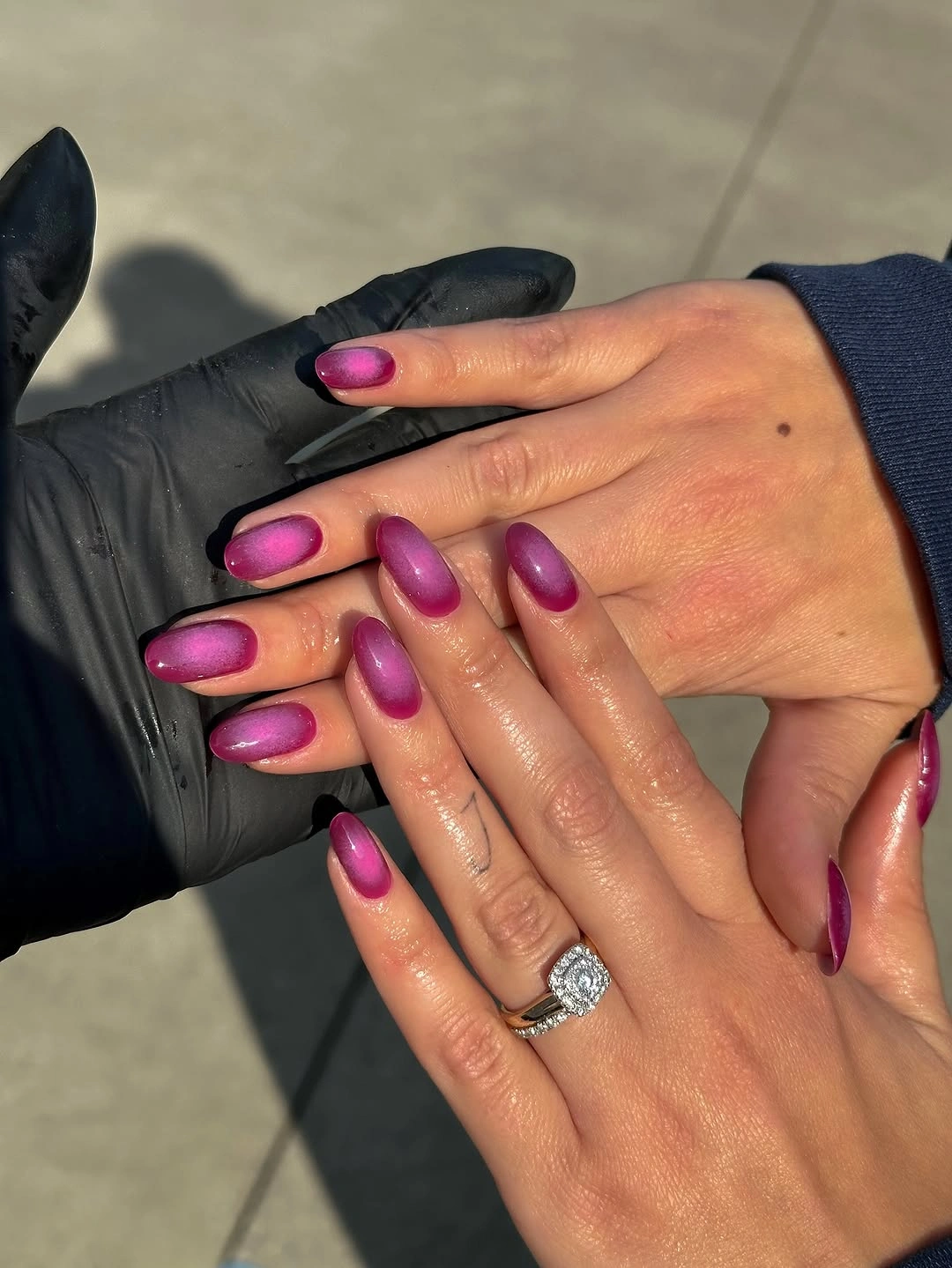 short berry purple almond nails with reflective shine