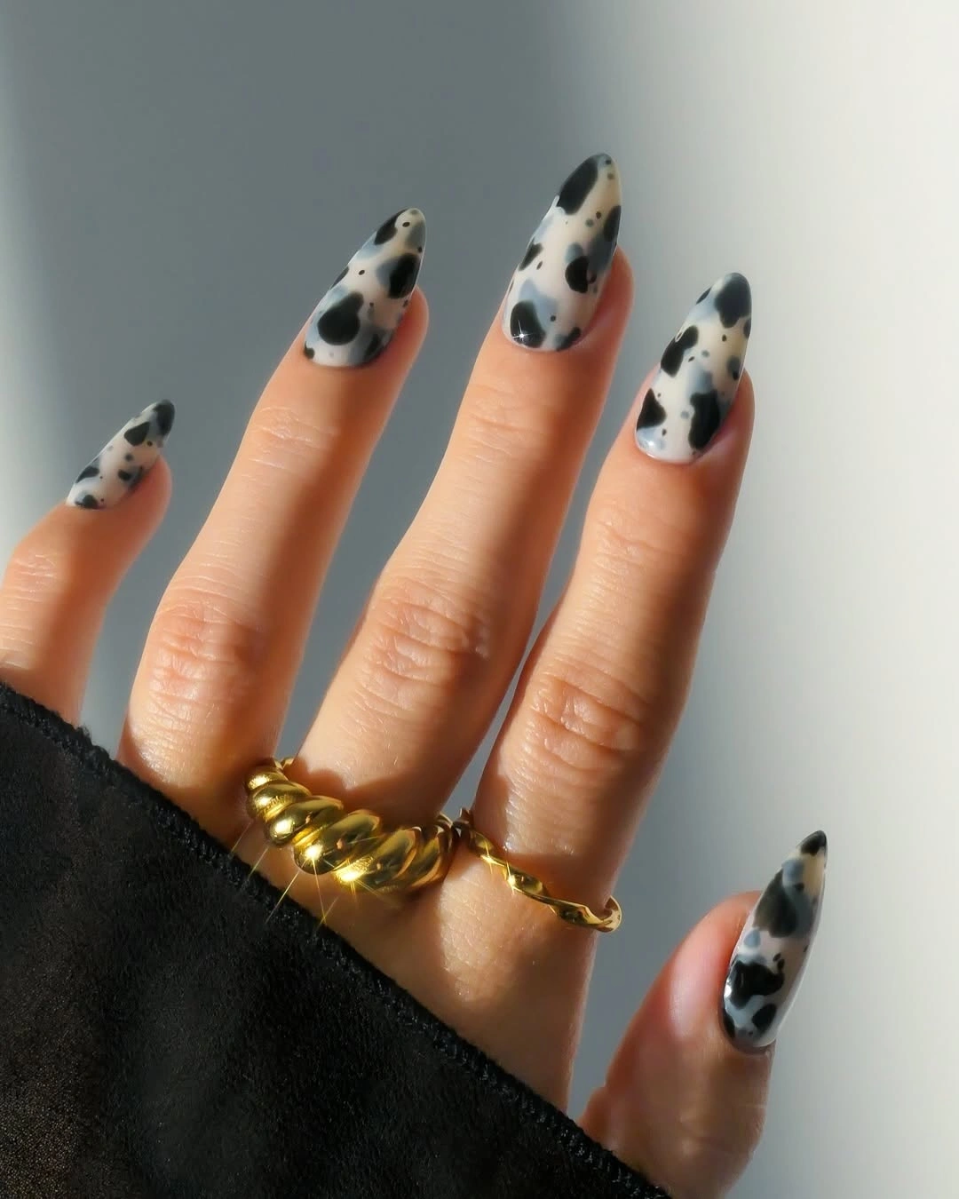 Cream cow print almond nails