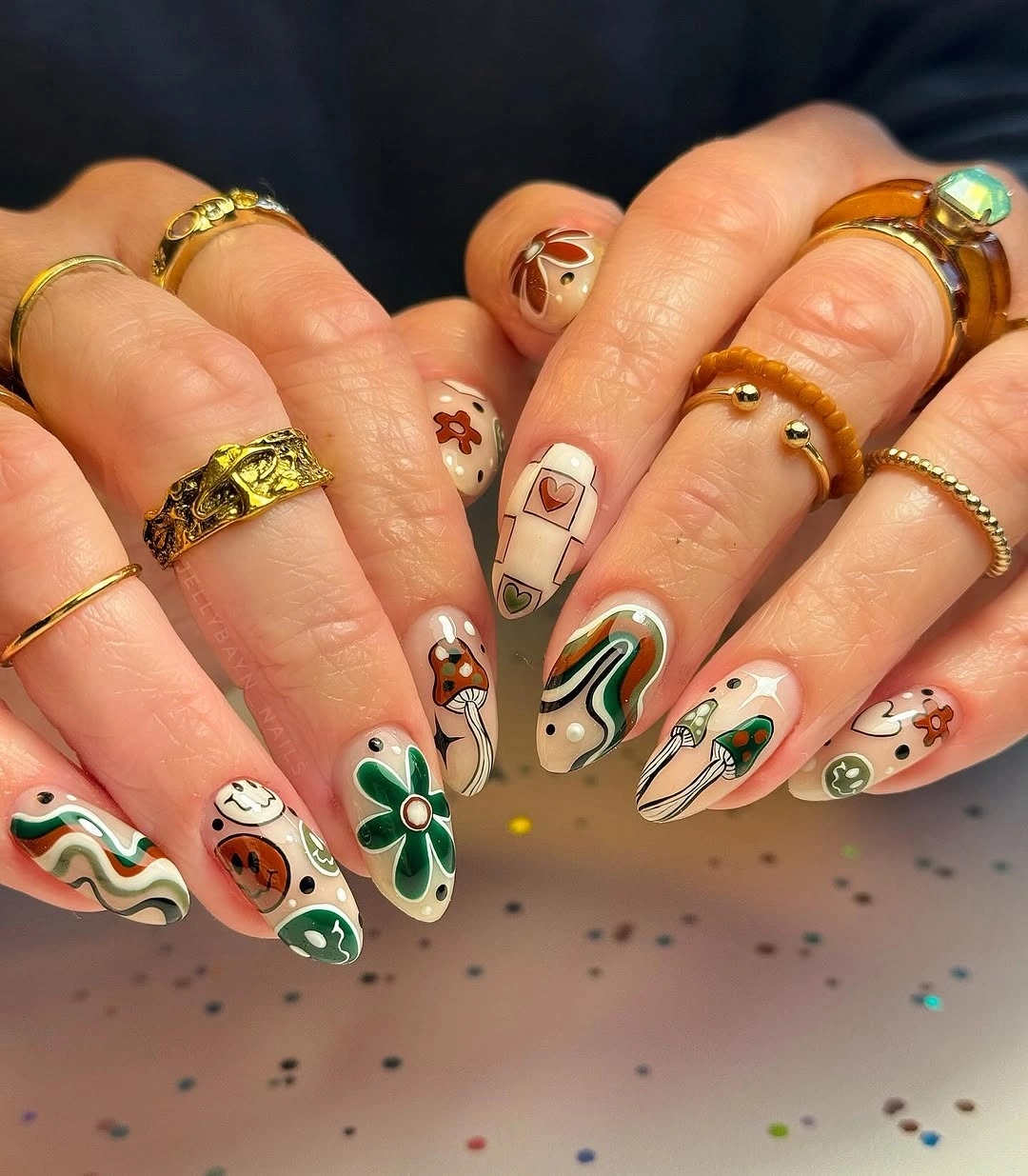 Green swirl nails with autumn art
