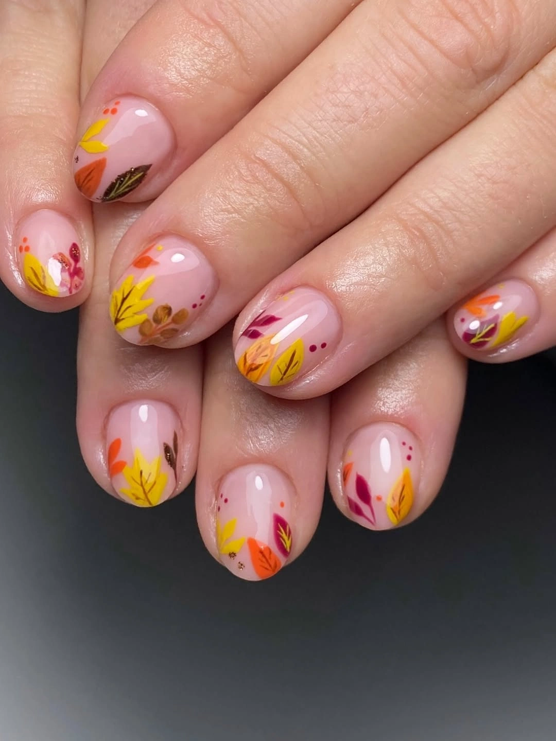Sheer short nails with golden leaves