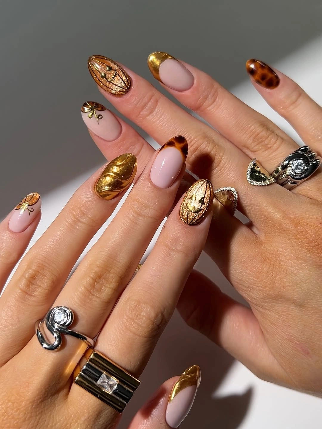 Gold chrome and tortoiseshell almond nails