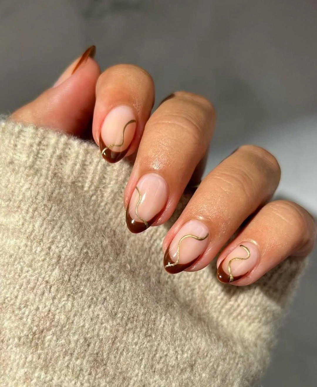 fine brown borders on short nude nails