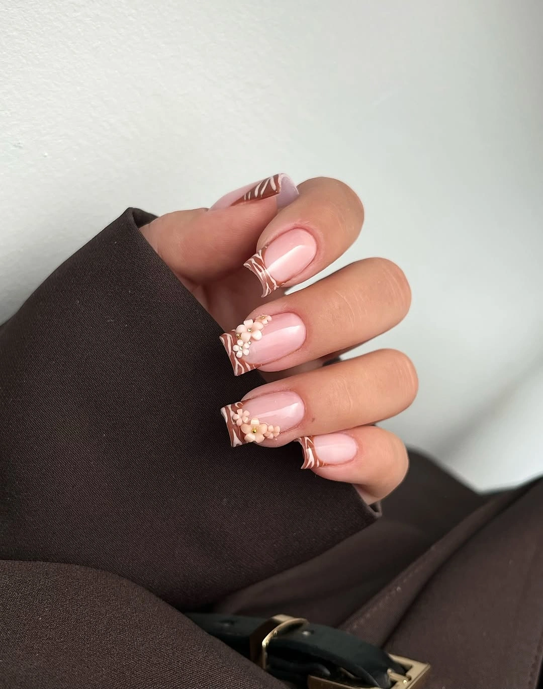 medium square pink nails with floral tip accents