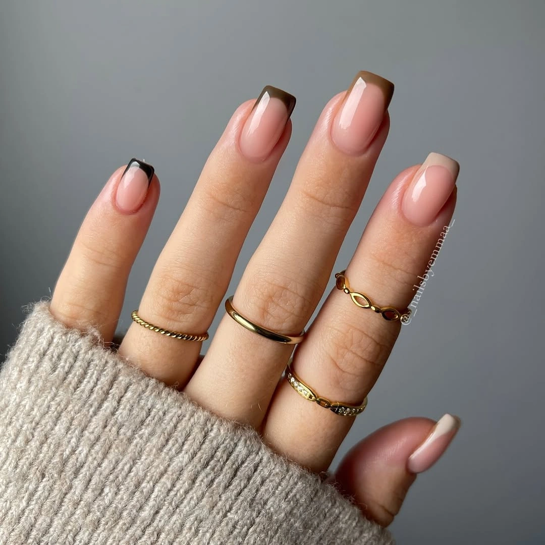 short square nails with small dark and brown French accents
