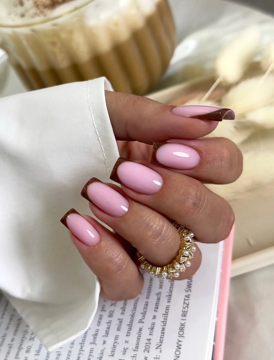 short square pink nails with chocolate French tips