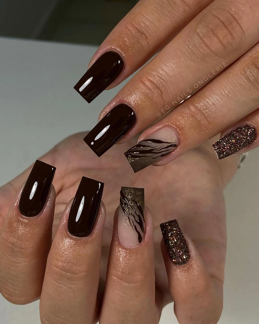 medium square espresso nails with abstract and glitter accents