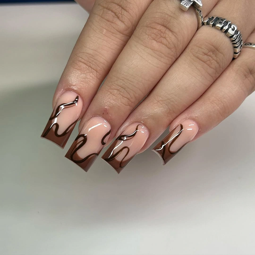 medium square pale nails with chocolate wave lines