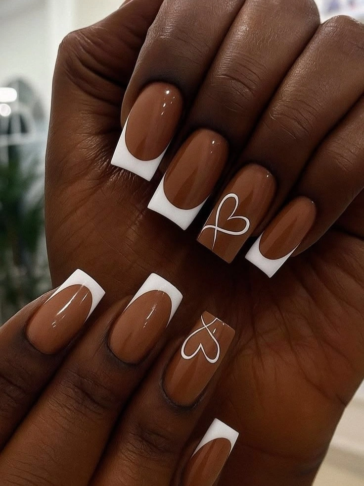 caramel square nails with white French tips and hearts