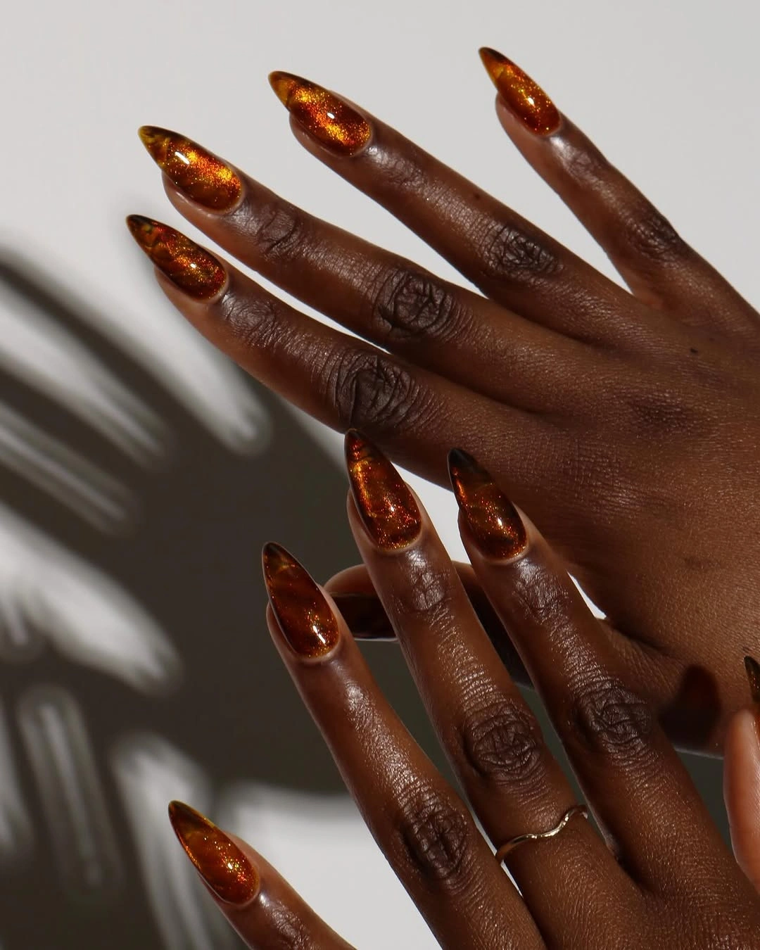 Reflective burnt copper stiletto nails