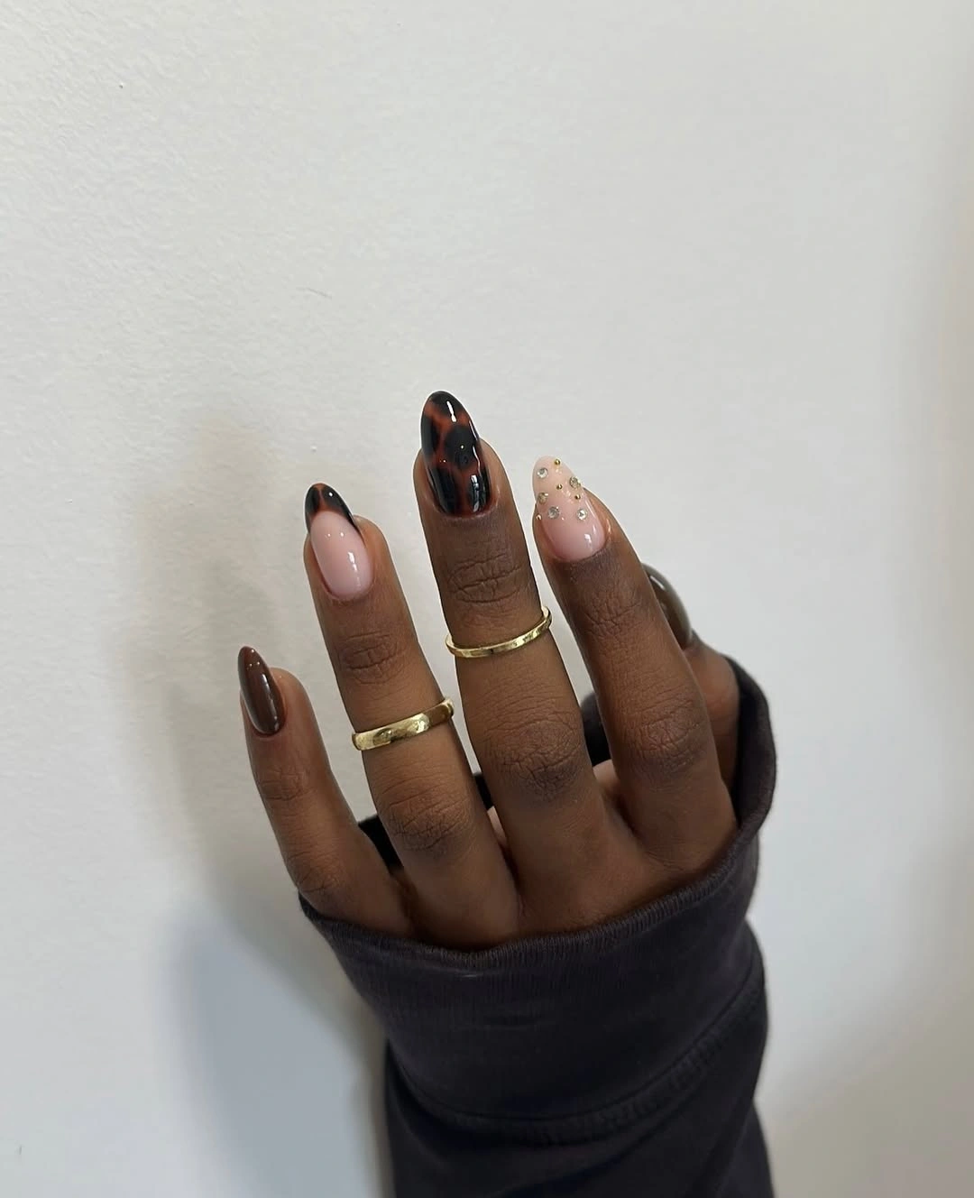 Chocolate almond nails with warm translucent patterned accents
