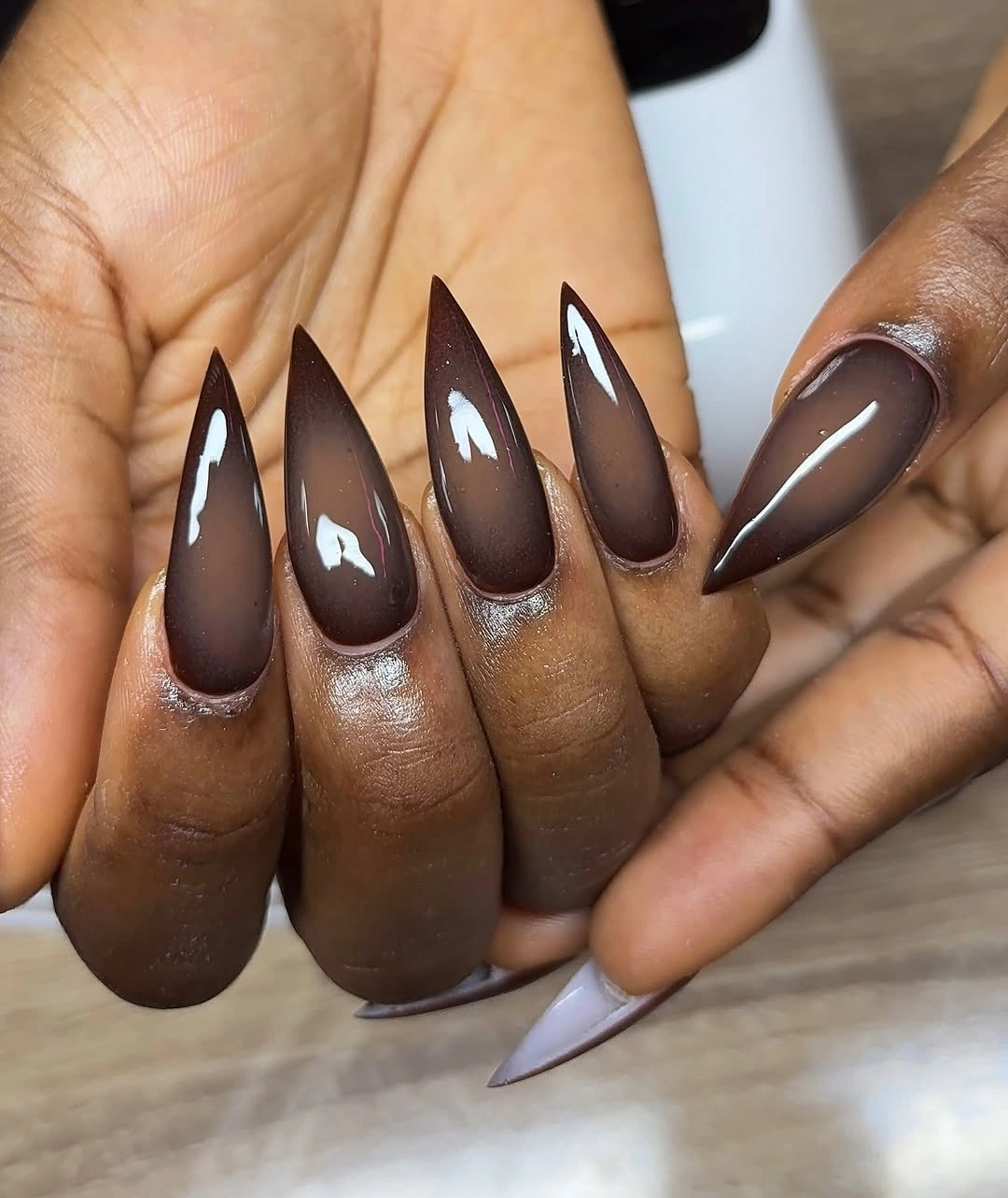 Smoky taupe pointed nails with darker glossy tips