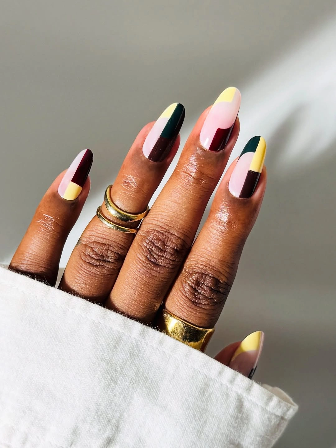 multicolor French tips on a nude almond base