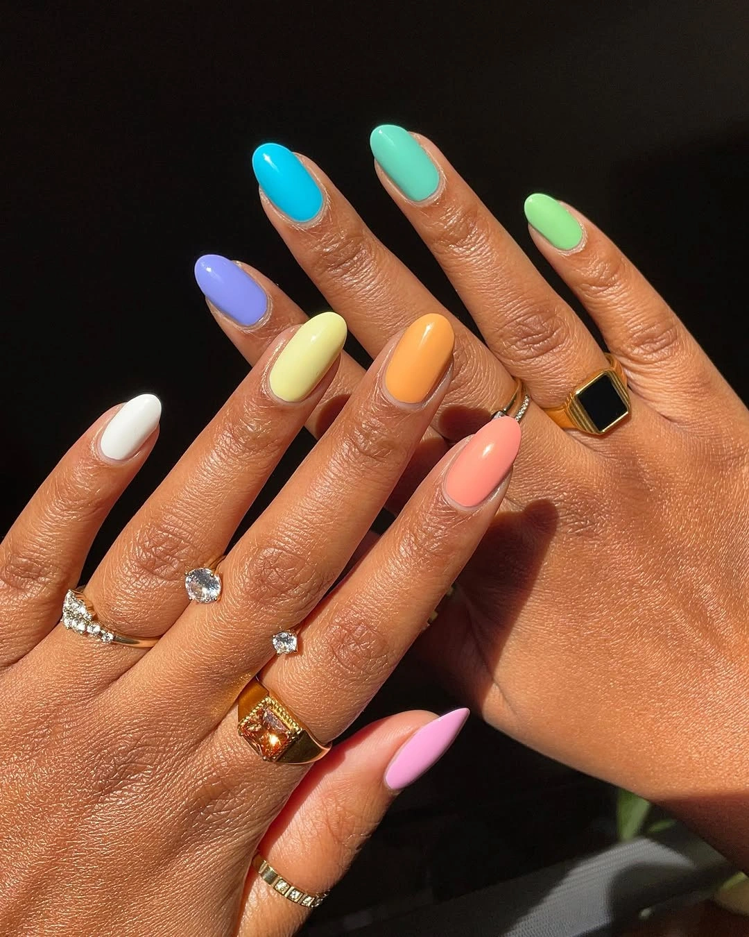 bright pastel multicolor nails with warm accents