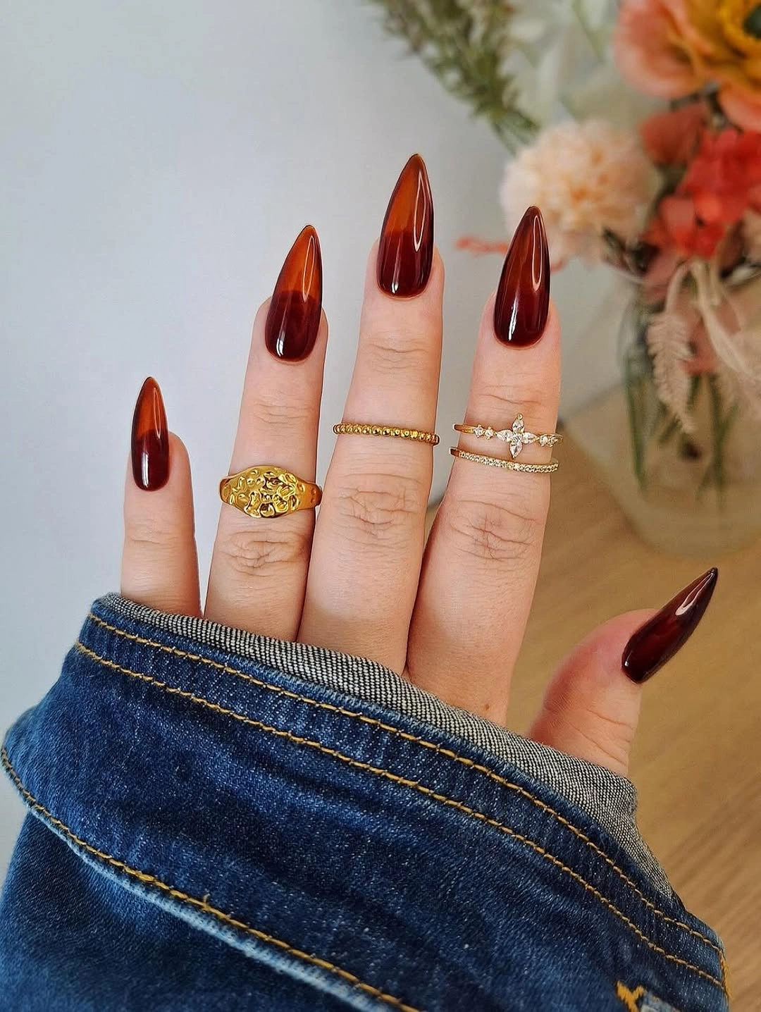 deep rust brown on long stiletto nails