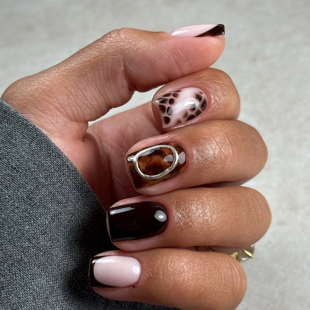 Pale pink and brown short almond accent nails