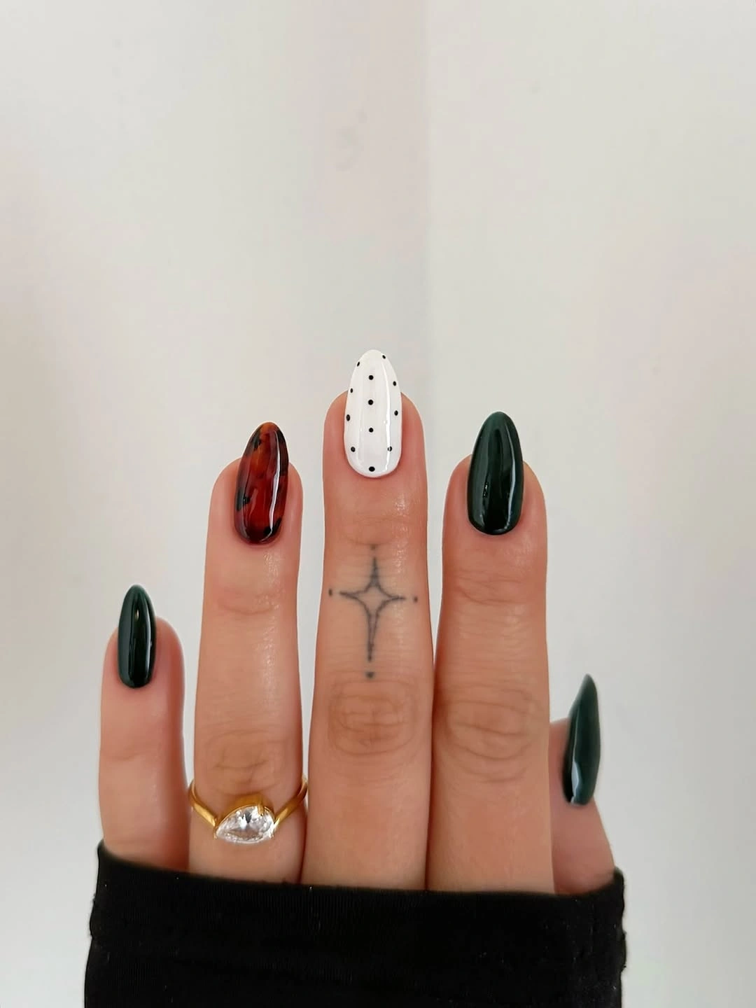 Green red and white almond nails with dotted detail