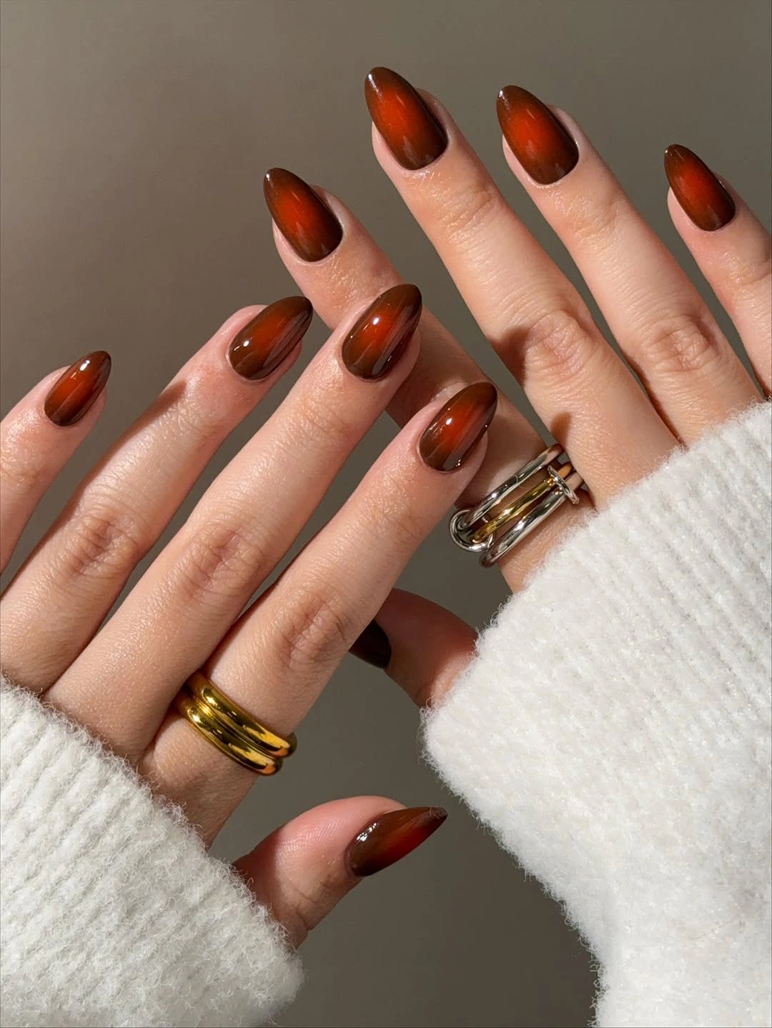 Translucent warm orange brown almond nails