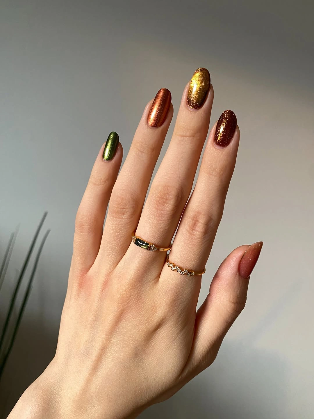 metallic green long almond nails with alternating metallic solids