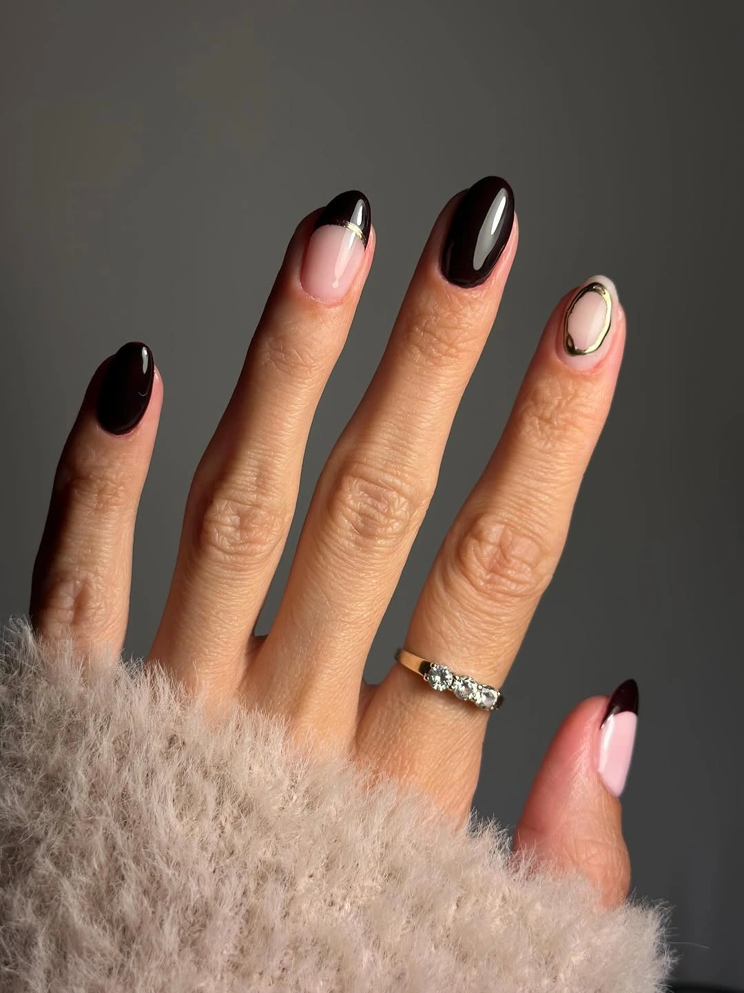 sheer nude long almond nails with dark curved tips
