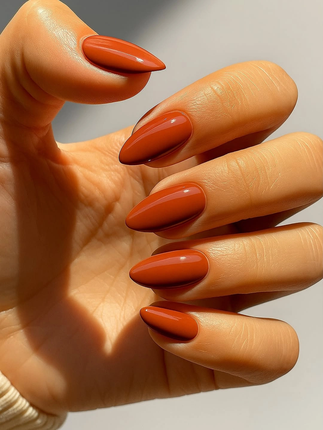 orange red long almond nails with single vivid color