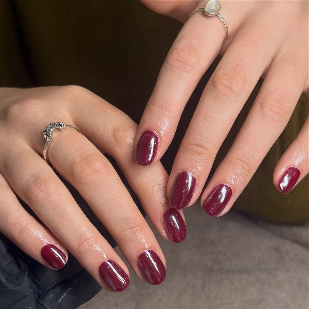 berry burgundy medium rounded nails with single berry shade