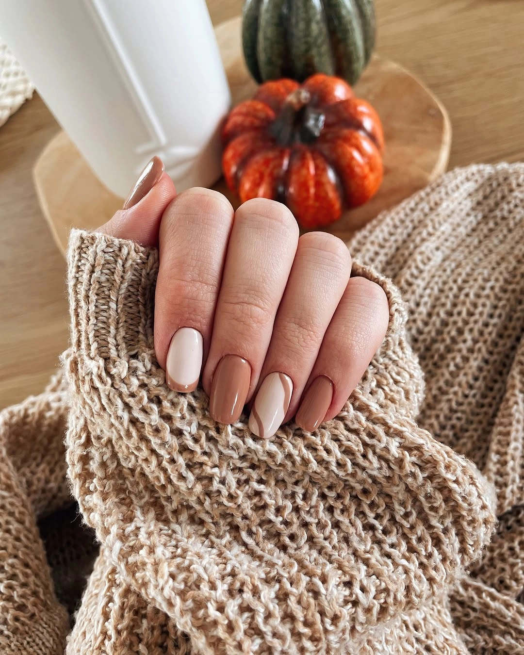 cream short rounded nails with tiny leaf accent