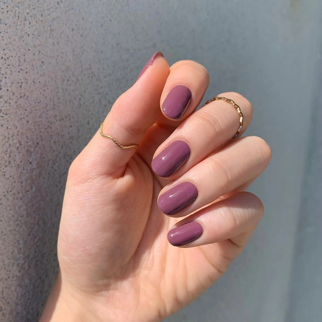 mauve purple short rounded nails with single muted shade