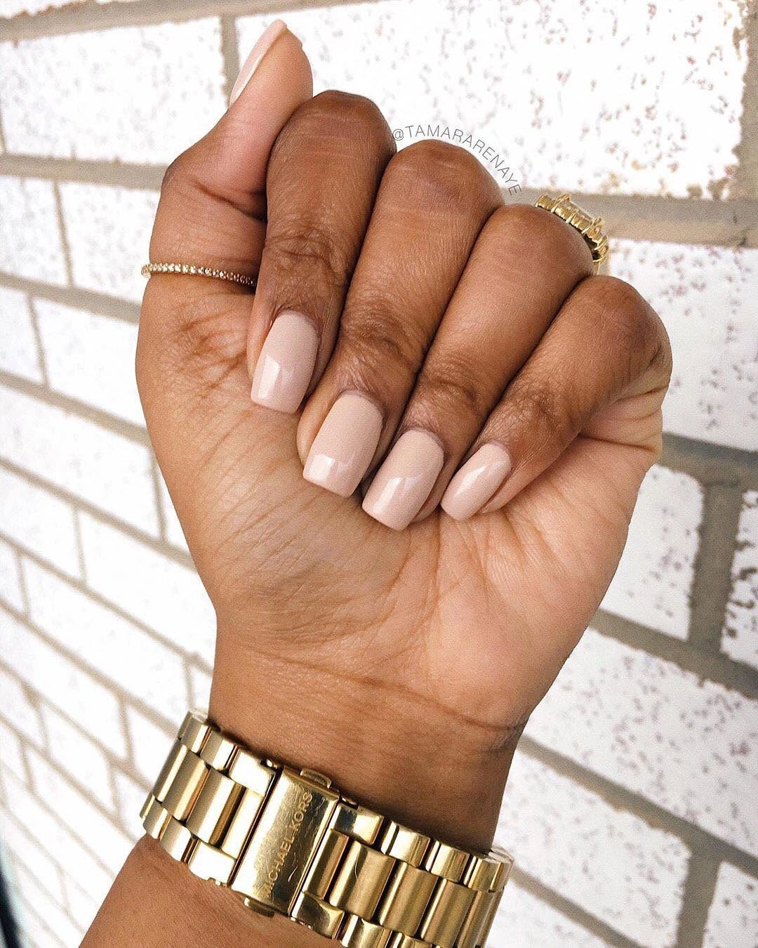 Pale nude pink polish on short square nails