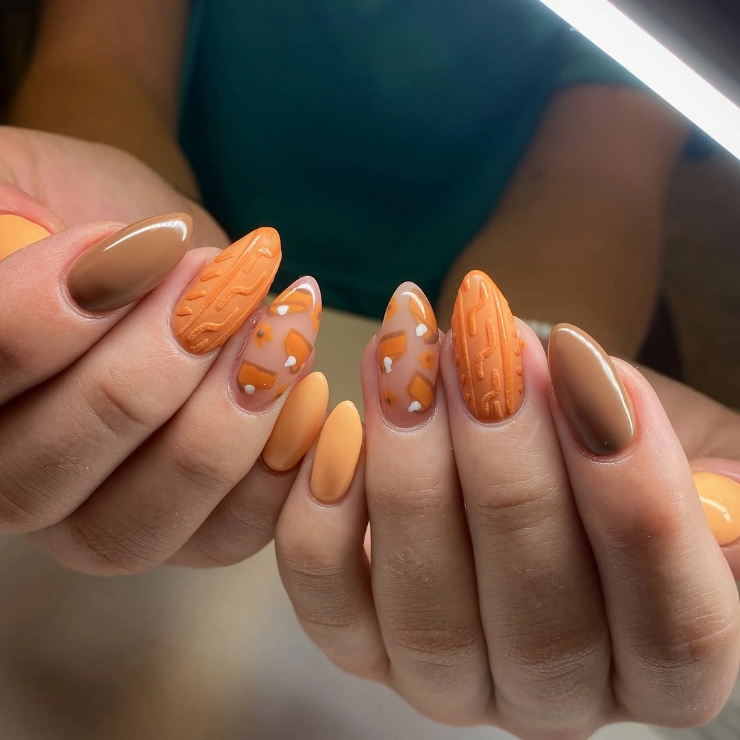 Fall nail idea: long pointed nude manicure with orange-brown tips